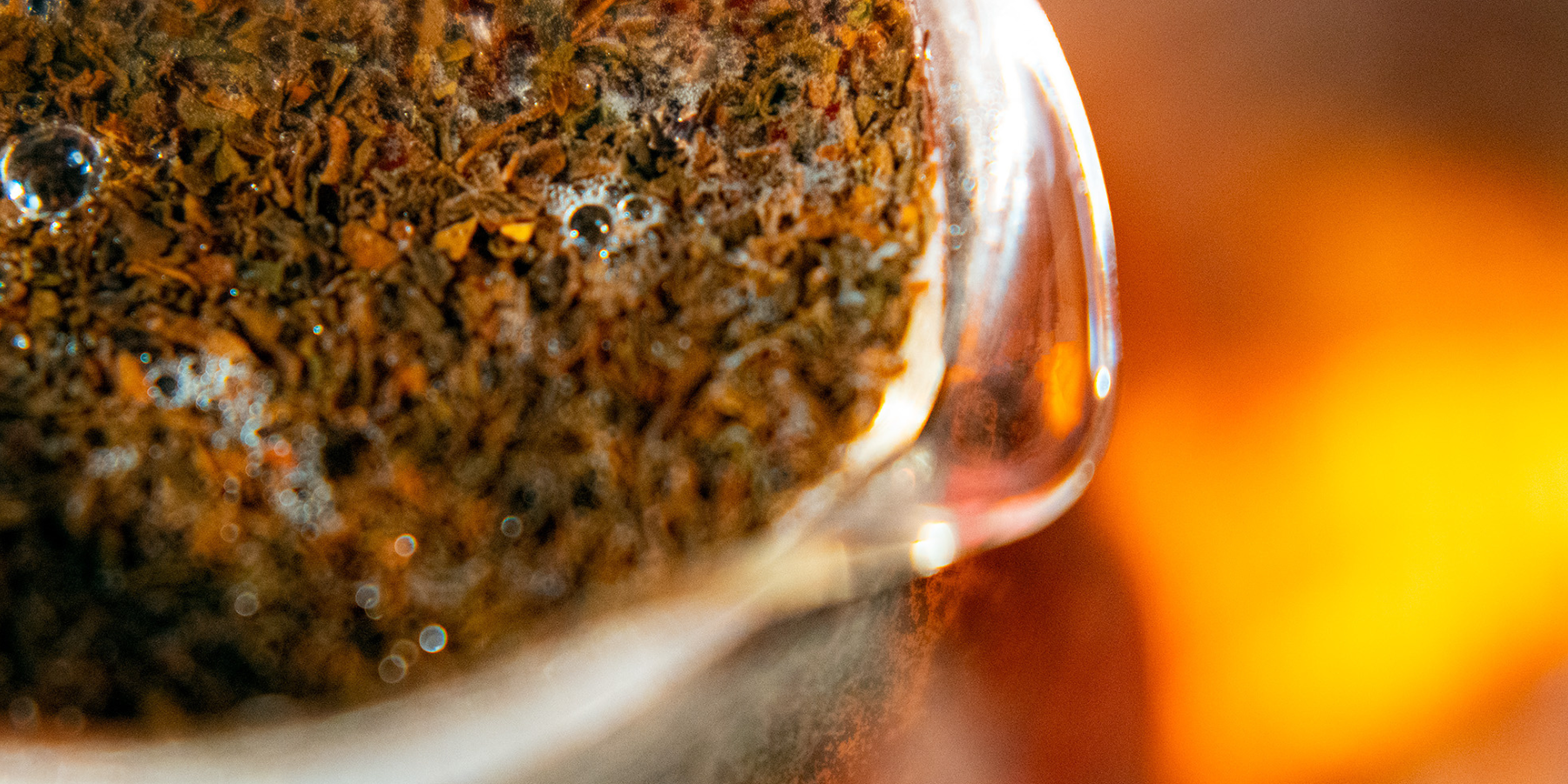 Close-up of black tea steeping in a glass beaker