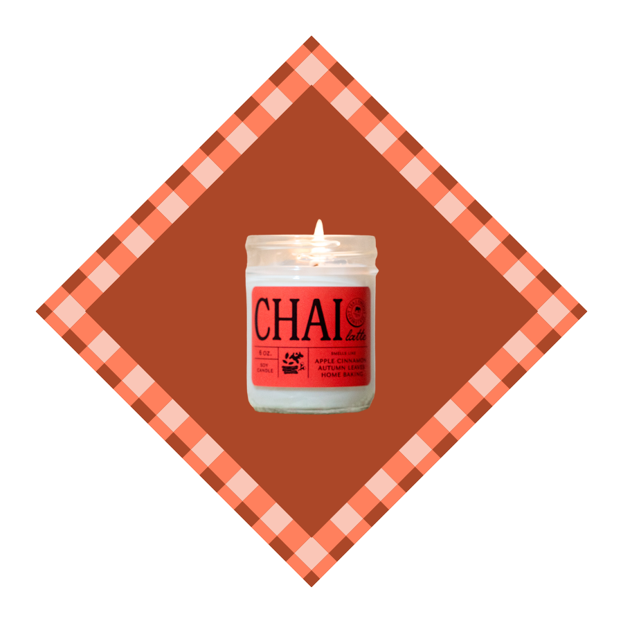 Candle labeled 'Chai' on a brown and orange checkered background