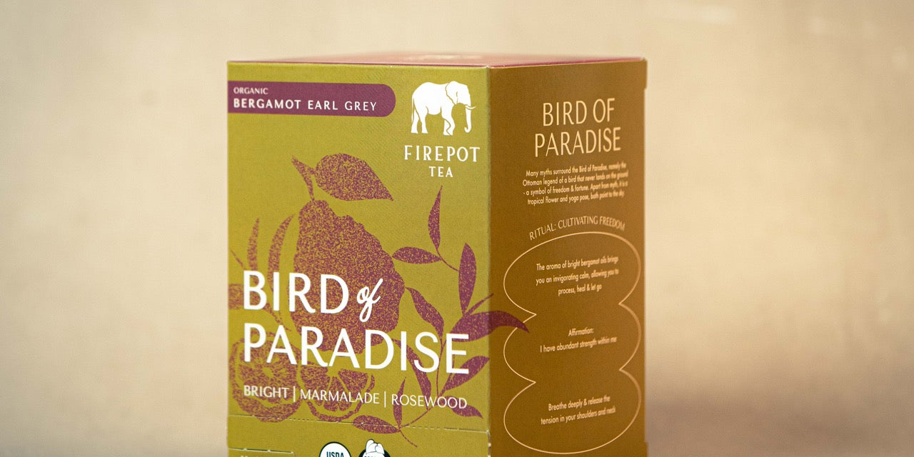 Tea box labeled 'Bird of Paradise' with green and brown design on a beige background