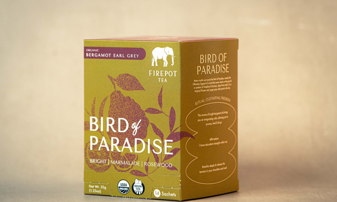 Tea box labeled 'Bird of Paradise' with green and brown design on a beige background