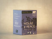 Firepot Tea 'House of Peace' packaging on a beige background