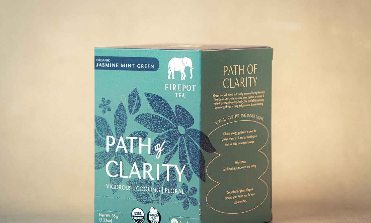 Box of 'Path of Clarity' tea from Firepot Tea on a beige background
