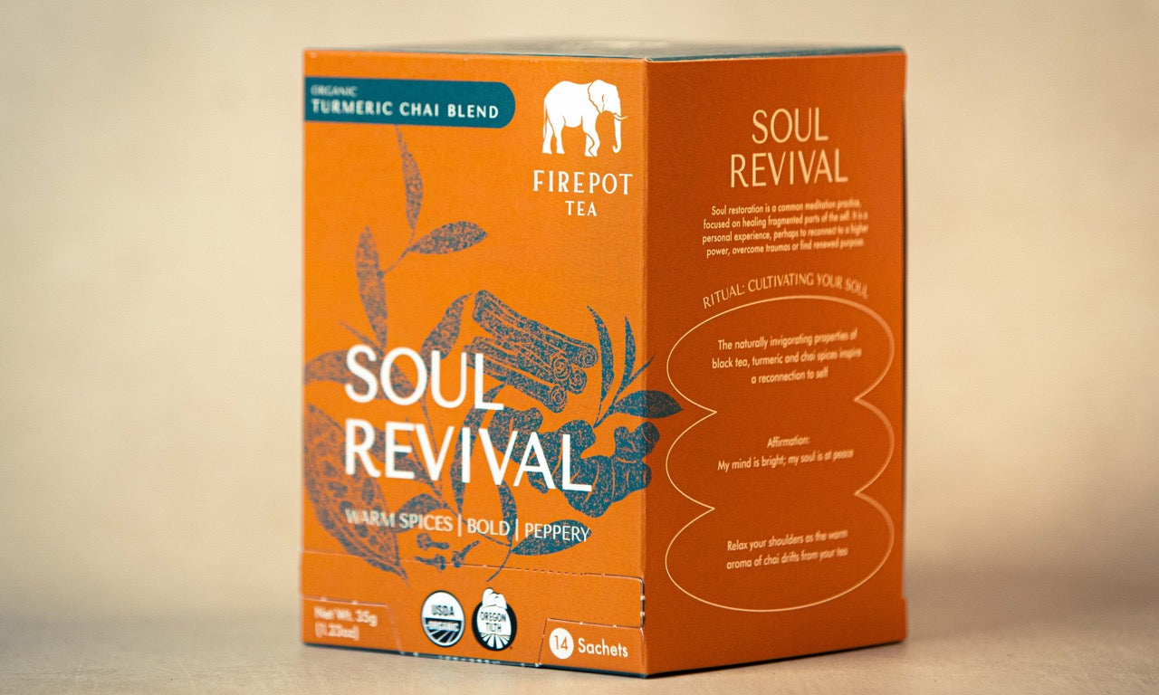 Orange box of Firepot Tea Soul Revival on a beige background