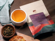fujian white peony 1oz bag with cup of tea