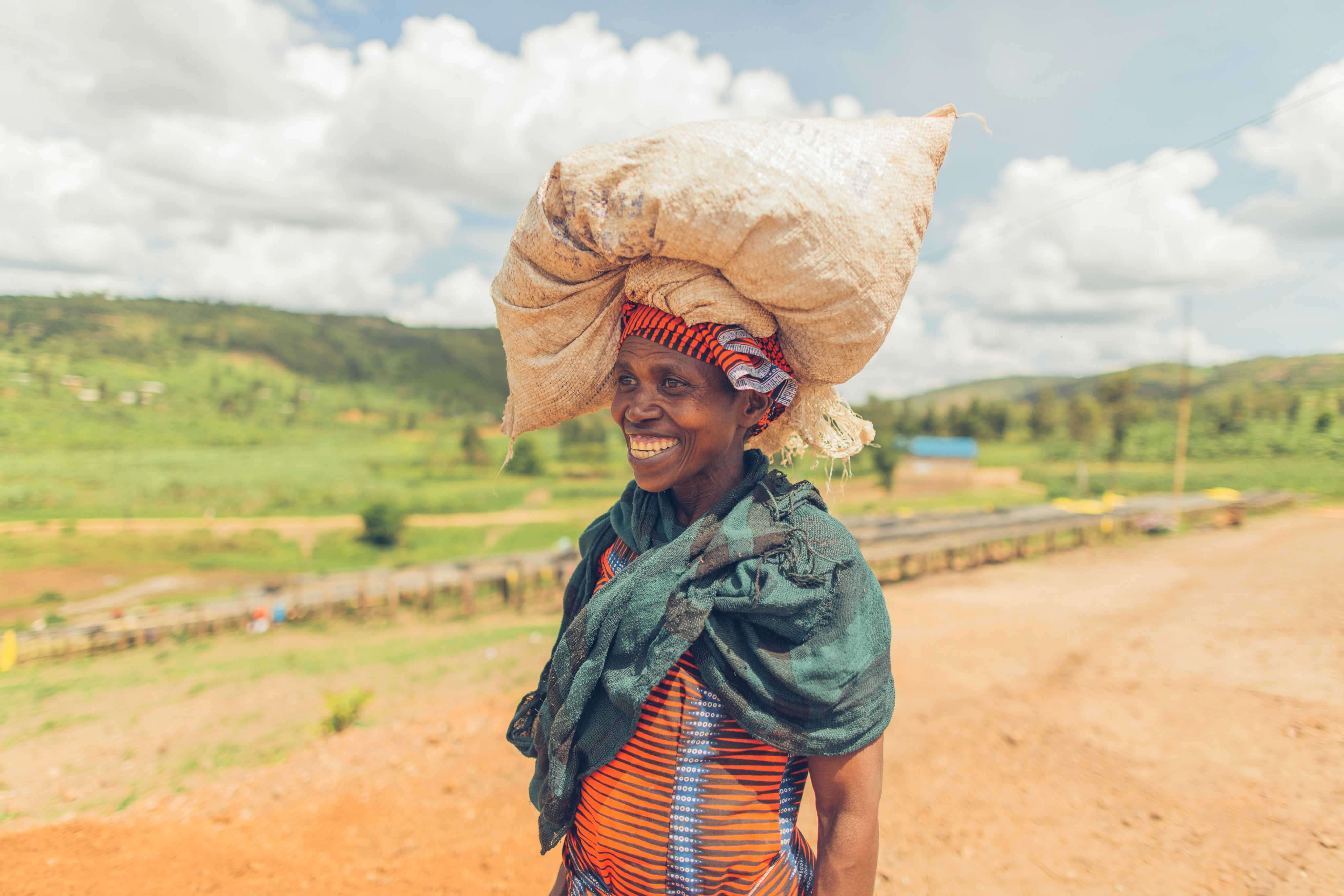 smiling woman with hills in background