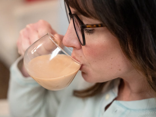 woman sipping masala chai latte