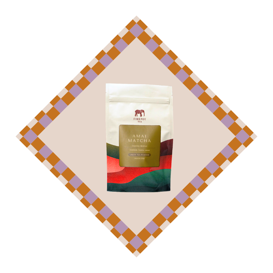 A stand-up pouch of Forest Fire Ammi Matcha tea centered on a beige diamond-shaped background with a brown and lavender checkered border. The pouch is off-white with a large olive-gold label reading 'AMMI MATCHA' and a colorful red, green, and blue wave design near the bottom.
