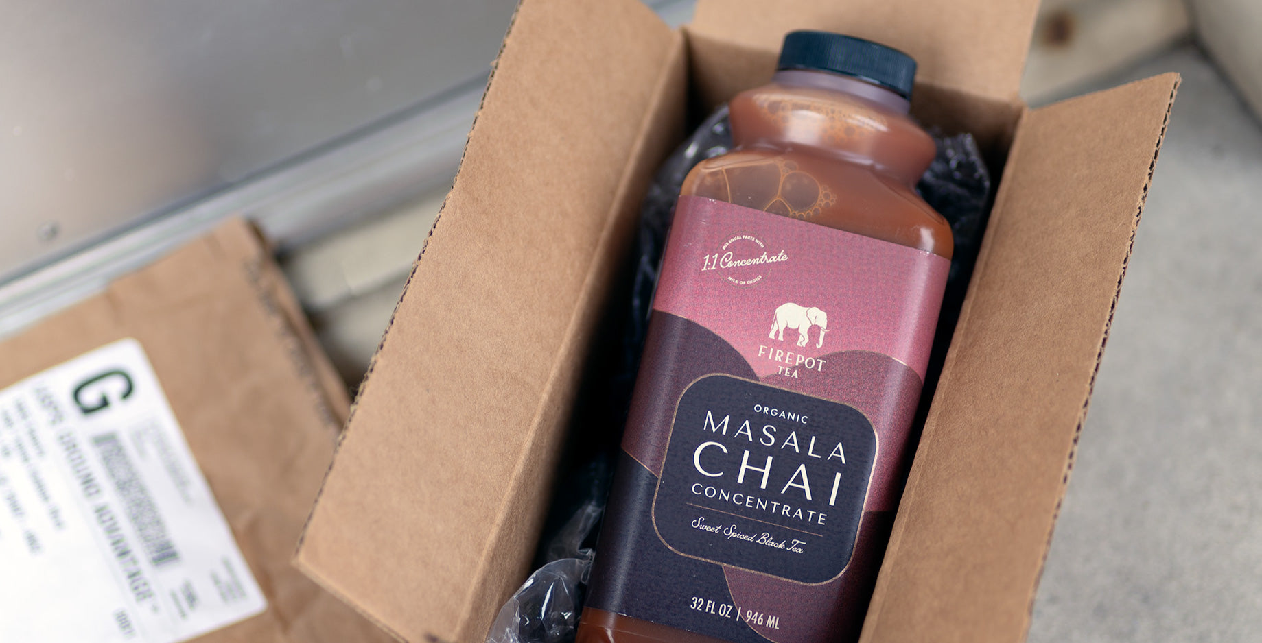 chai concentrate in a box on a front porch