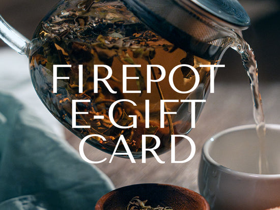 Firepot e-Gift Card text overlayed on a photo of loose leaf white peony tea and a cup of steeped tea