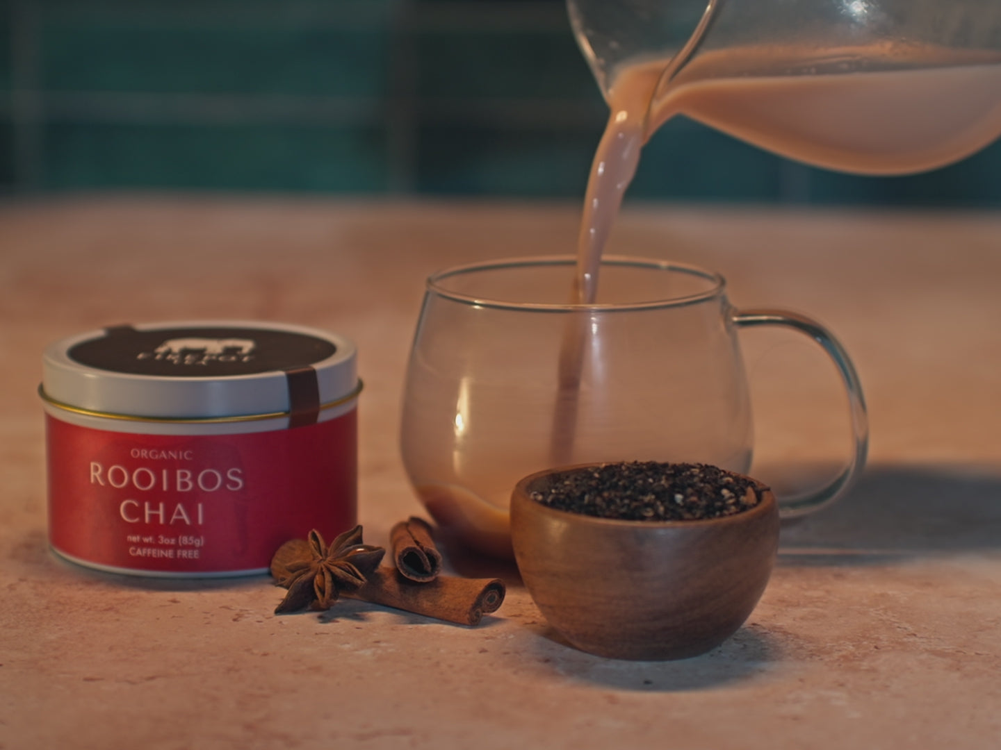Load and play video in Gallery viewer, video of rooibos chai 3oz tin and a latte being made
